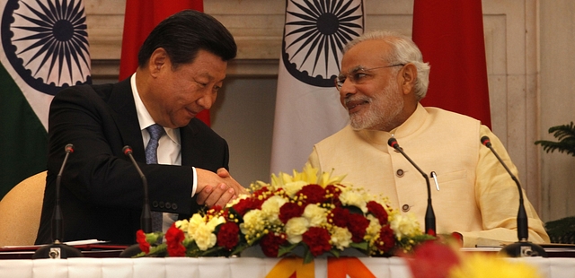 Chinese President Xi Jinping with Indian PM Narendra Modi. (Arvind Yadav/Hindustan Times via Getty Images)