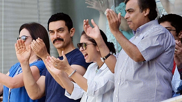 Amir Khan and Mukesh Ambani during the ICC Cricket World Cup 2011 Final match. (Naveen Jora/India Today Group/Getty Images)