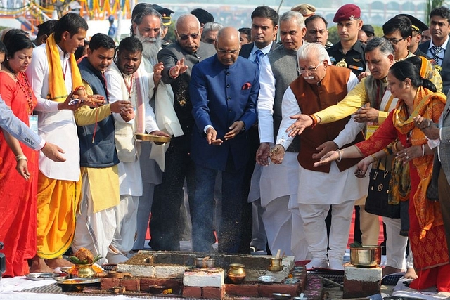 President Ram Nath Kovind (C) with Governor Haryana Kaptan Singh Solanki, CM Haryana Manohar Lal Khattar and, Governor Himachal Acharya Dev Vrat during an inauguration of International Gita Mahotsav 2017 at  Brahma Sarover, on November 25, 2017 in Kurukshetra. (Photo by Anil Dayal/Hindustan Times via Getty Images)