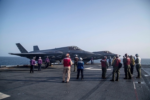 F-35B Lighting fighter jets on an American aircraft carrier. (Photo by Cpl. Francisco J. Diaz Jr./U.S. Marine Corps via Getty Images)