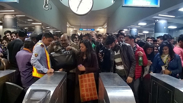 Long queues witnessed as people use public transport at Rajiv Chowk Metro Station. The DMRC issued the advisory in the view of the rush and high-security measures on the new year’s eve. (Sanchit Khanna/Hindustan Times via Getty Images)