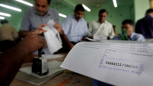 People queuing up at the Income Tax office in Mumbai to file their returns. (Satish Bate/Hindustan Times via Getty Images)