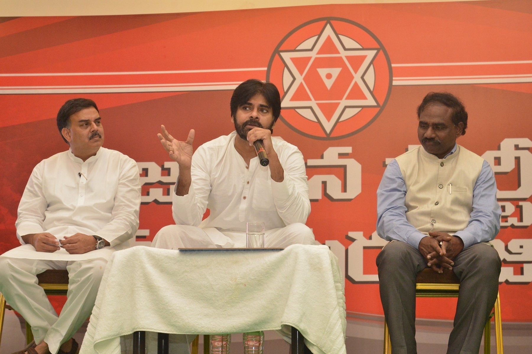 Pawan Kalyan (C) with N Manohar (L) (@JanaSena/Facebook)