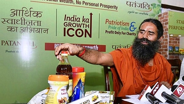 Baba Ramdev with Patanjali products (Arvind Yadav/Hindustan Times via Getty Images)