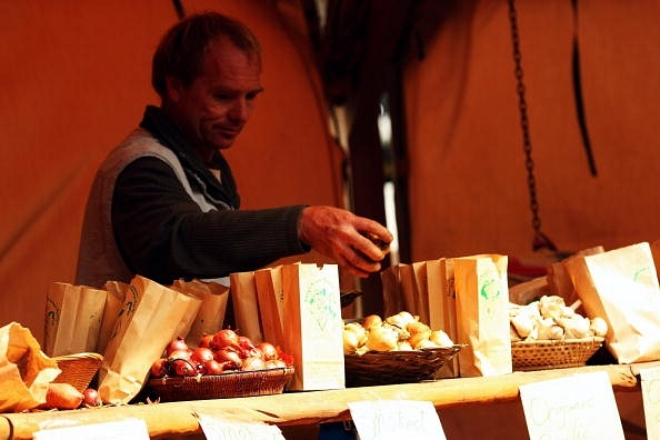 Representative image of onion and garlic being sold at a farmers’ market in New Zealand. (Photo by Phil Walter/Getty Images)