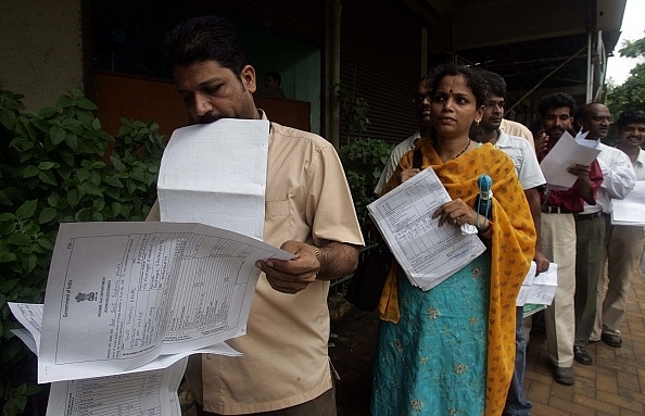 People queued up outside the Income Tax office at Bandra, Mumbai. (Photo by Satish Bate/Hindustan Times via Getty Images)