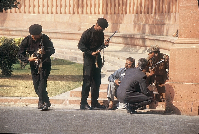 Armed security officers guard the Parliament building during the attack. (Bandeep Singh/The India Today Group/GettyImages)&nbsp;