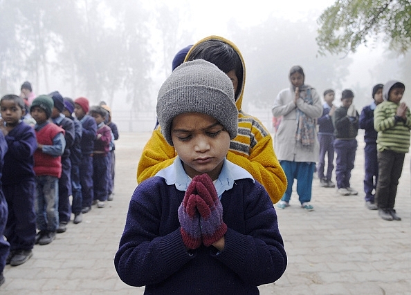 Students during a prayer at a government primary school in New Delhi. (Photo by Vipin Kumar/Hindustan Times via Getty Images)