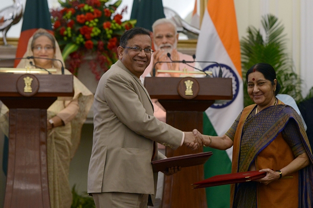 Prime Minister Narendra Modi and Bangladesh Prime Minister Sheikh Hasina watch as Foreign Minister Sushma Swaraj exchange a memorandum of understanding (MoU) with Bangladesh Minister of Law, Justice and Parliamentary Affairs Anisul Huq. (Parveen Negi/India Today Group/Getty Images)