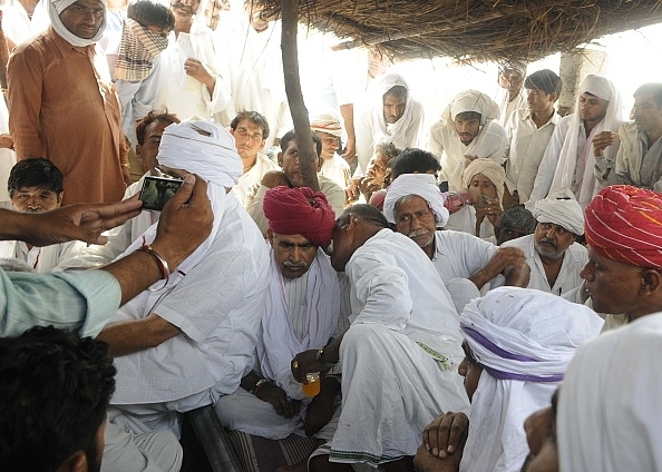 Gurjar leader Lt Col (retd) Kirori Singh Bainsla with community members during the 2015 reservation agitation in Bharatpur. (Photo by Himanshu Vyas/Hindustan Times via Getty Images)