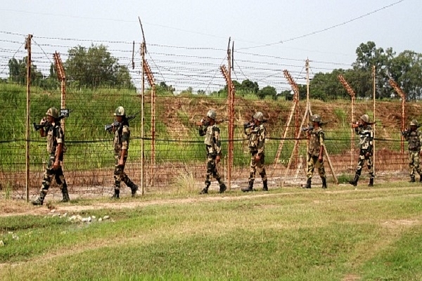 BSF soldiers patrolling the international border with Pakistan near Jammu. (Photo by Nitin Kanotra/Hindustan Times via Getty Images)