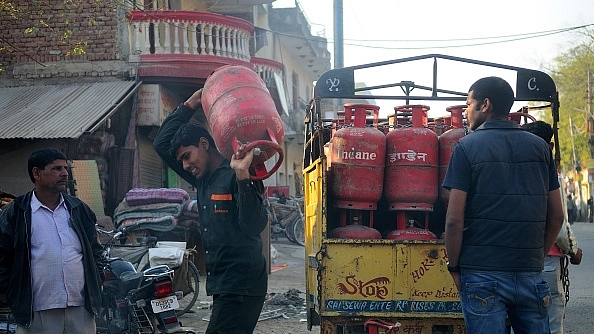 Customers picking up their LPG cylinders in New Delhi (Priyanka Parashar/Mint via Getty Images)