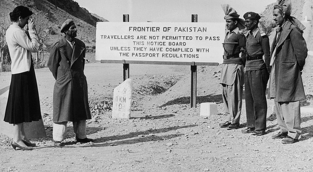 A woman taking a photograph at the frontier between Pakistan and Afghanistan. (Photo by Richard Harrington/Three Lions/Getty Images)