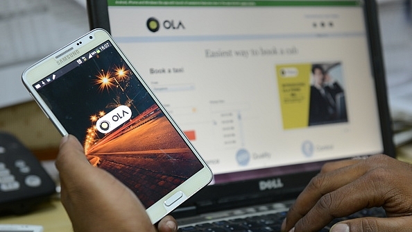 Representative image of the Ola app on a smartphone (Hemant Mishra/Mint via Getty Images)