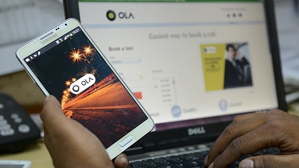 Representative image of the Ola app on a smartphone (Hemant Mishra/Mint via Getty Images)