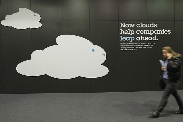 A woman walks past a could computing presentation at the IBM stand  in Hanover, Germany. (Sean Gallup/GettyImages)&nbsp;