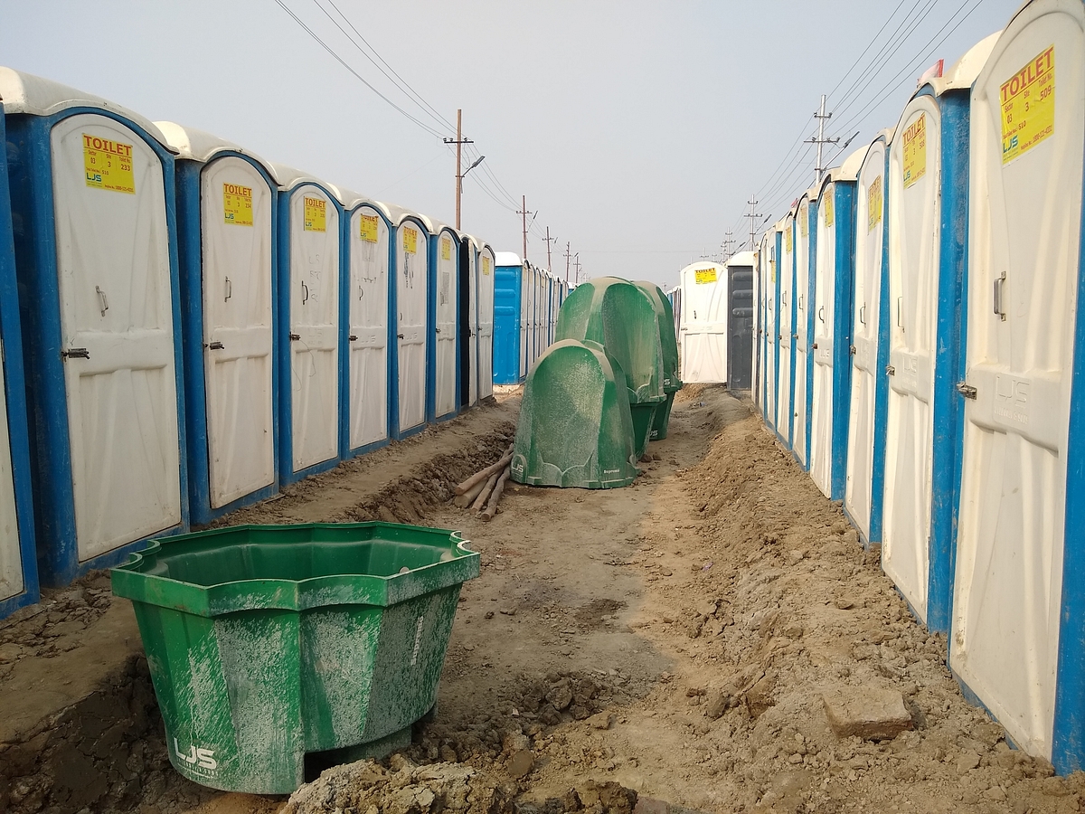 One can see rows of these toilets in the <i>mela</i> area in Prayagraj. In the middle, one can see the green urinals.