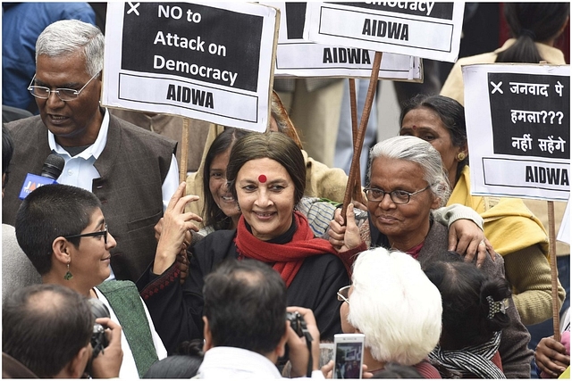 Representative image: CPI leader Brinda Karat, D. Raja, JNU students, professors and CPI party members protest at JNU Campus in 2016 (Photo by Sanjeev Verma/Hindustan Times via Getty Images)