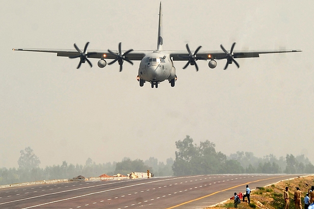 An Indian Air Force Hercules C-130J prepares to touch down at the Agra-Lucknow Expressway. (SANJAY KANOJIA/AFP/Getty Images)