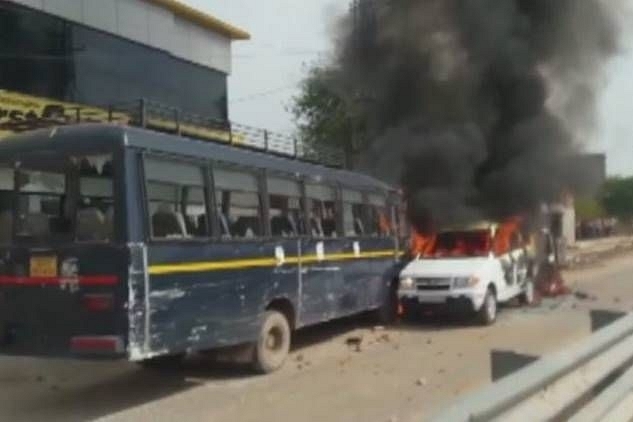 SP Ajay Singh said that agitators set on fire three police vehicles, including two jeeps and a bus (Source: @ANI/Twitter)