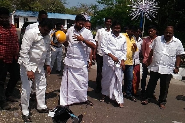 AIADMK MLAs smashing the helmets (@thekiranbedi/Twitter)