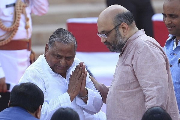 SP leader, the late Mulayam Singh Yadav and BJP leader, Amit Shah in 2014 (Ajay Aggarwal/Hindustan Times via Getty Images)