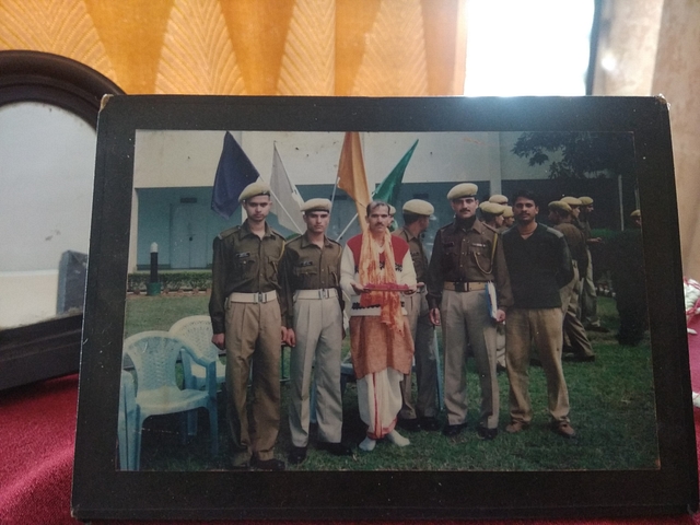 Mohan Lal Raturi, dressed in a dhoti kurta, with his colleagues. 