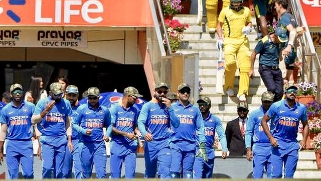 Indian cricket team wearing military camouflage caps during an ODI against Australia (Pic: twitter)