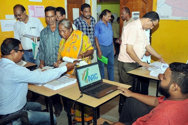 People check their name on the final draft list of Assam NRC list at NRC Seva Kendra at Hatigaon on July 30, 2018 in Guwahati (representative image) (Photo by Rajib Jyoti Sarma/Hindustan Times via GettyImages)