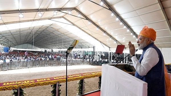 Prime Minister Narendra Modi addressing a gathering at the launch of the Pradhan Mantri Shram Yogi Maan-dhan Yojana (PM-SYM), in Vastral, Gujarat on March 5, 2019. (PIB/PMO)