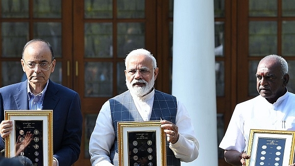 Prime Minister, Shri Narendra Modi releasing the new series of visually impaired friendly circulation coins, at a function, at 7 Lok Kalyan Marg, New Delhi on 7 March 2019 (PIB/PMO)