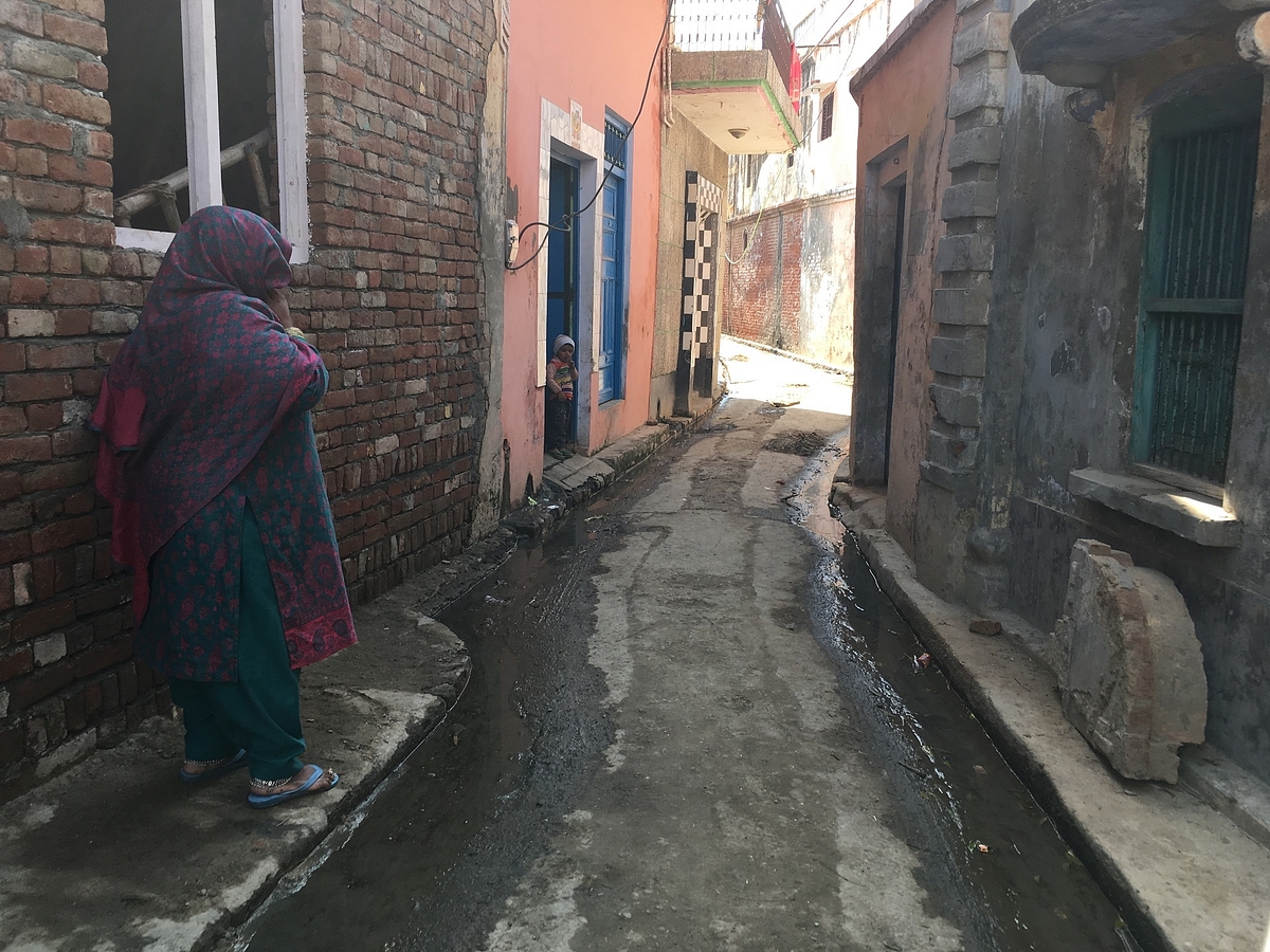 Imran’s mother outside their house in Sinauli