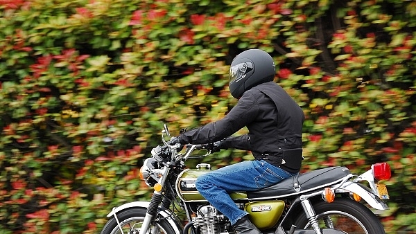 A motorcycle rider wearing a helmet. (Wikimedia Commons)