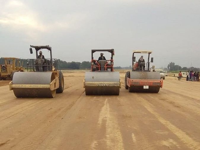 Soil being compacted with road rollers in Pachhin Patti village of UP’s Azamgarh district. (UPEIDA/Twitter)