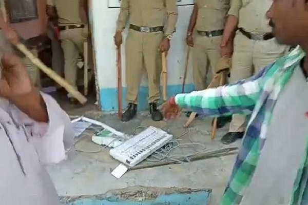 Smashed EVM lying on the ground OpIndia/Twitter)