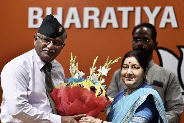 BJP senior leader Sushma Swaraj welcomes Lieutenant General (retd) Sarath Chand as he joins the party in New Delhi on Saturday. (PTI Photo/Ravi Choudhary)