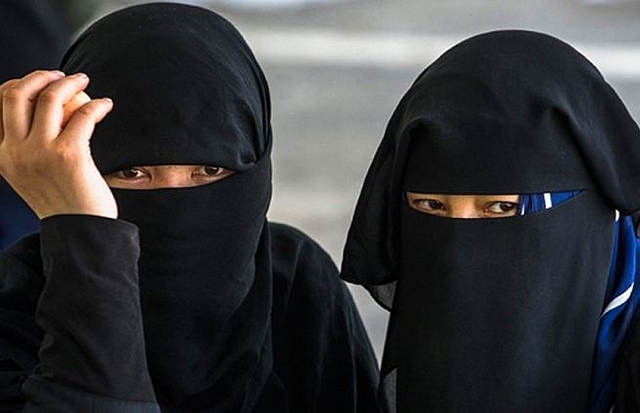 Muslim women in niqab.