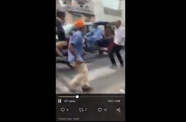 A screenshot from the video where driver Sarabjeet is seen attacking a policeman with a sword (Source: @manishmedia/Twitter)