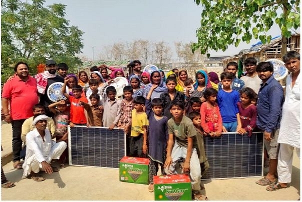 Hindu refugees from Pakistan with the solar panels and fans (pic via Twitter)