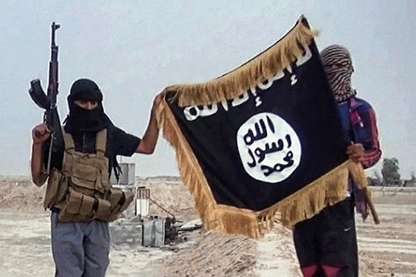 ISIS terrorists holding their flag. (File Photo)