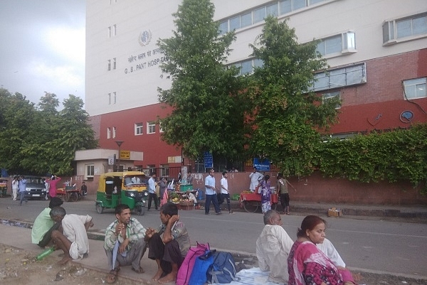 Relatives and patients wait outside Delhi’s GB Pant Hospital.&nbsp;