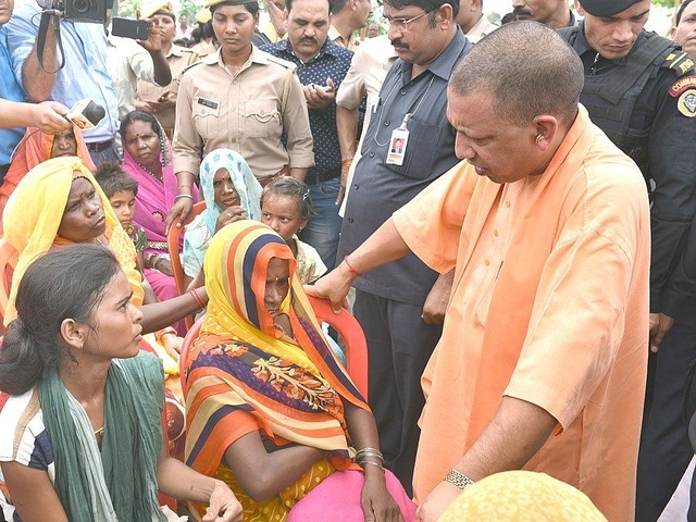 CM Adityanath meets the victims. (pic via Twitter)