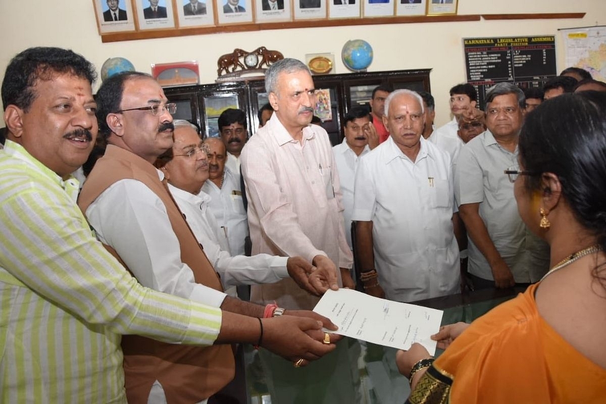 Vishweshwara Hegde Kageri, fourth from left, filing his nomination to the post of the Speaker to the Assembly secretary MK Vishalakshi.  CM Yediyurappa and other leaders of BJP accompanied him. (@bjparvind/Twitter)