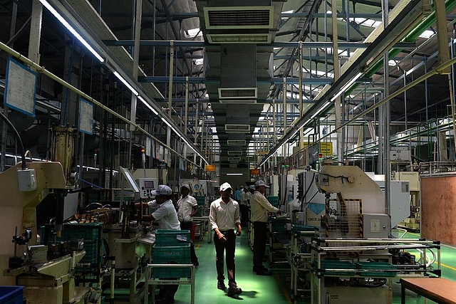 Workers manage machines at a factory of Sona Koyo Steering Systems in Dharuhera some 80km south of New Delhi.  (Chandan Khanna/AFP/GettyImages)