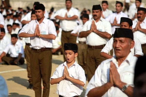 RSS volunteers performing yoga (Nitin Kanotra/Hindustan Times via Getty Images)