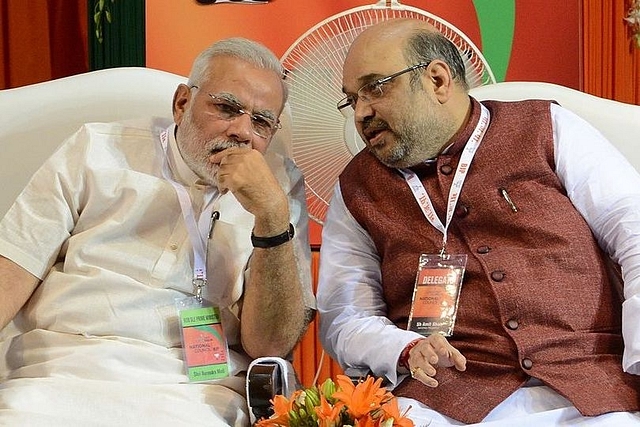 Prime Minister Narendra Modi with BJP president Amit Shah. (Photo credit:  RAVEENDRAN/AFP/Getty Images))