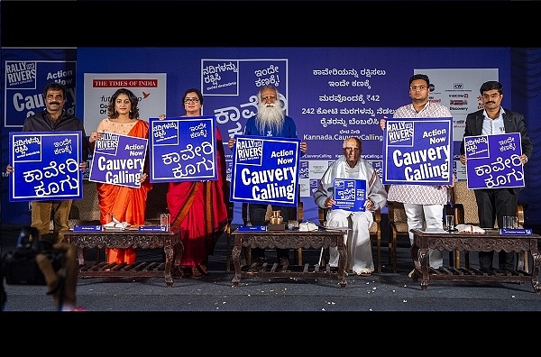 Dignitaries holding ‘Cauvery Calling’ signs prior to the rally.