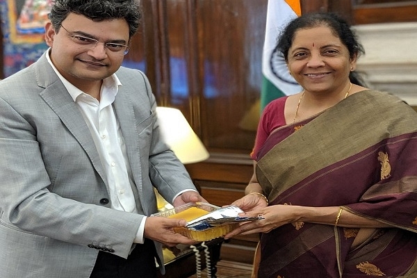 Anand Ranganathan presenting Mysore Pak to Nirmala Sitharaman (Pic via twitter)