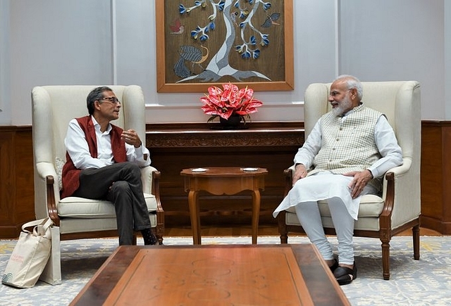 PM Modi with Abhijit Banerjee. (via Twitter)