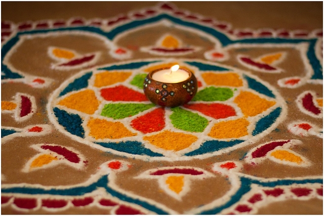 A Diwali lamp and rangoli (flickr.com)&nbsp;